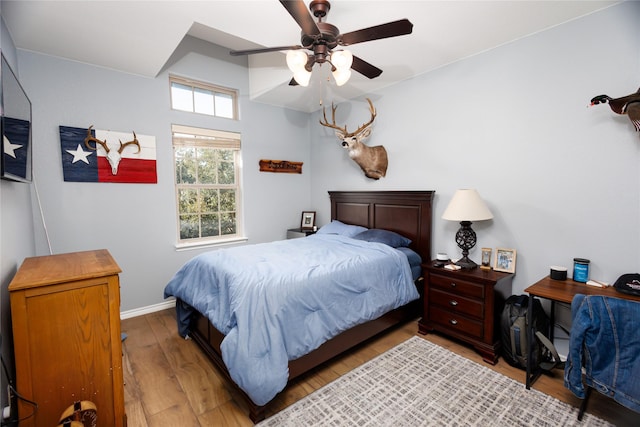 bedroom with ceiling fan and light wood-type flooring