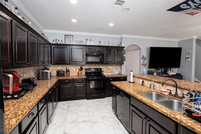 kitchen featuring tasteful backsplash, sink, ornamental molding, black appliances, and dark brown cabinets