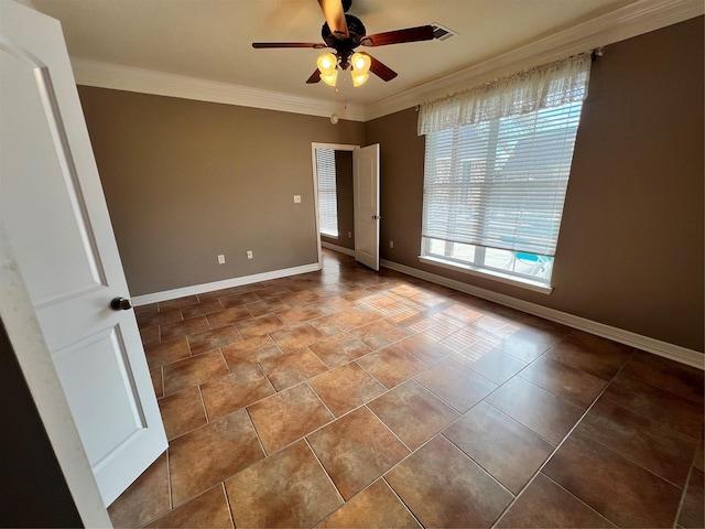 empty room featuring ornamental molding and ceiling fan