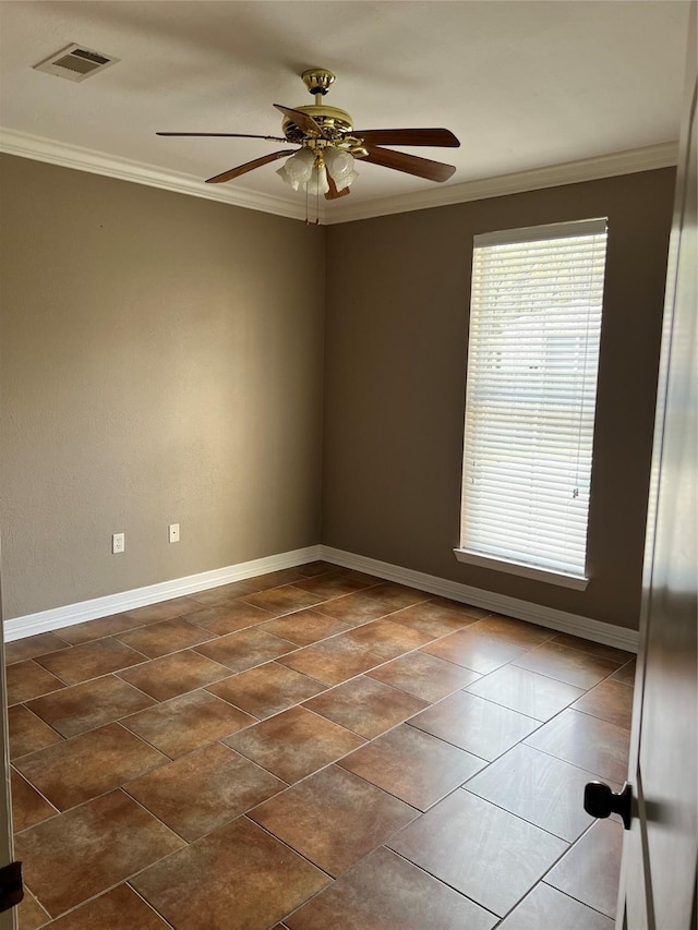 empty room featuring ceiling fan and ornamental molding