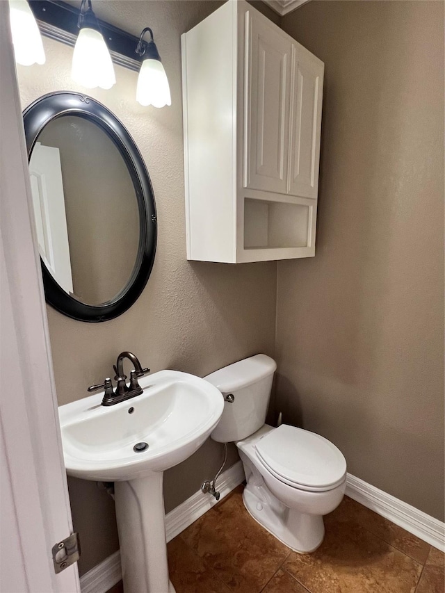 bathroom with tile patterned floors and toilet