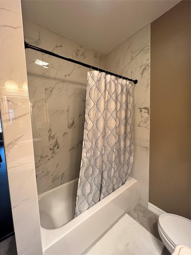 bathroom with toilet and shower / bath combo with shower curtain