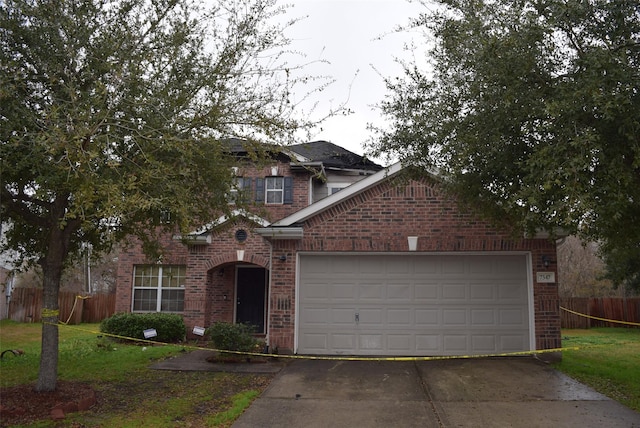 view of front of home featuring a garage and a front yard