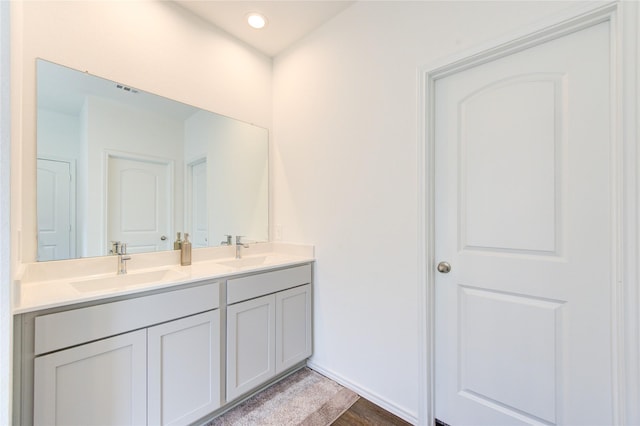 bathroom featuring vanity and hardwood / wood-style floors