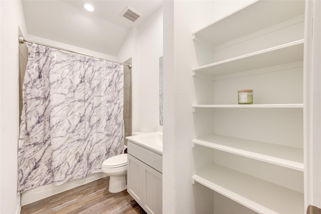 full bathroom with vanity, hardwood / wood-style floors, shower / bath combination with curtain, and toilet