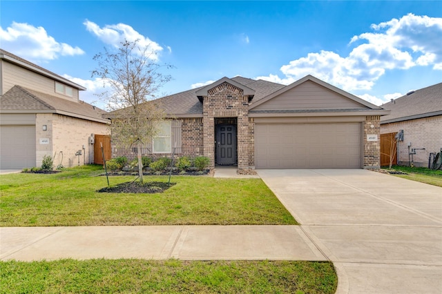 view of front of house with a garage and a front yard