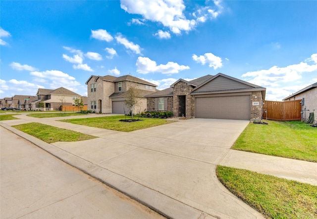 view of front of property featuring a garage and a front lawn