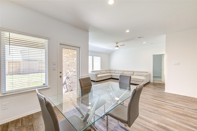 dining space with light hardwood / wood-style flooring and ceiling fan