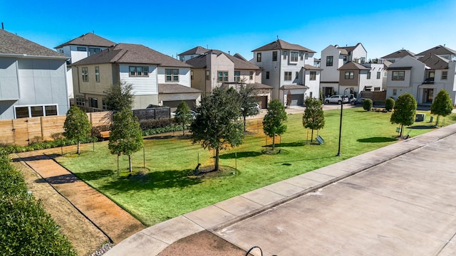 view of property's community with a yard