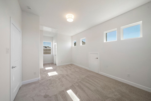 spare room with light colored carpet