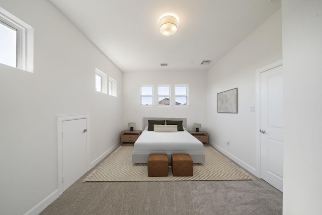 bedroom featuring light colored carpet