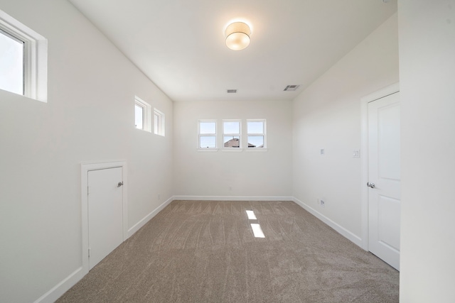 unfurnished room featuring carpet