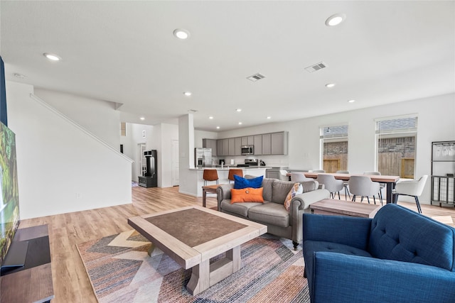 living room with light hardwood / wood-style flooring