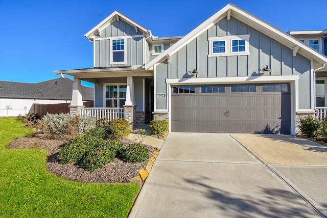 view of front of home with a porch and a garage