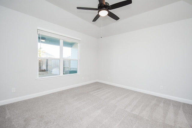 unfurnished room with ceiling fan and carpet