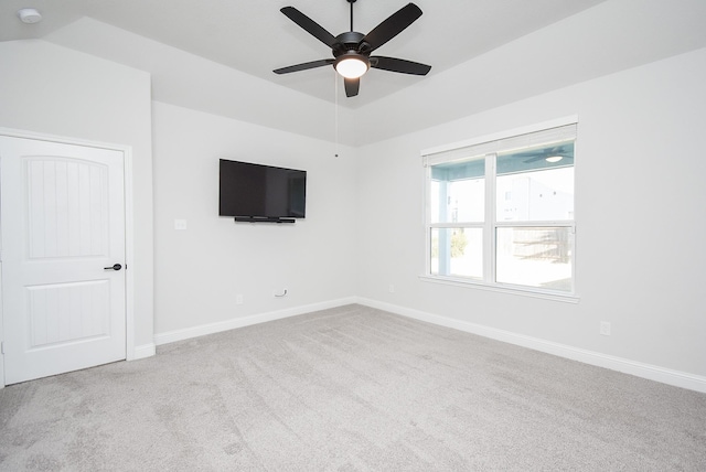 carpeted spare room with ceiling fan