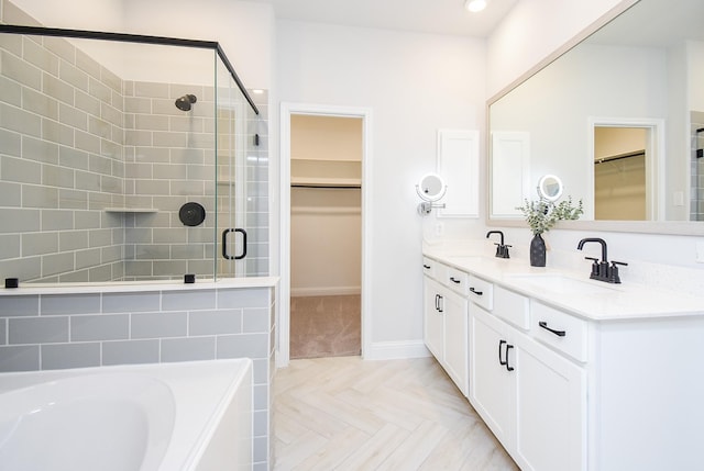 bathroom with parquet floors, vanity, and separate shower and tub