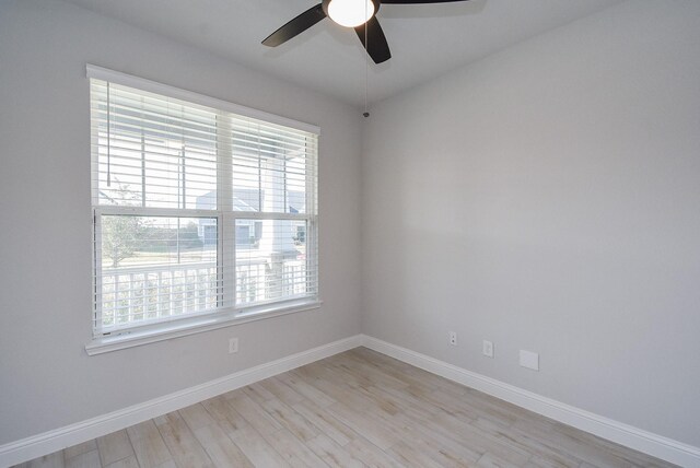 spare room with ceiling fan and light hardwood / wood-style floors