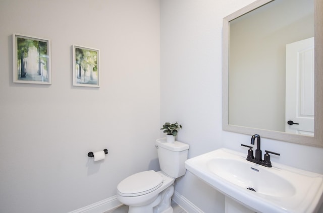 bathroom with sink and toilet