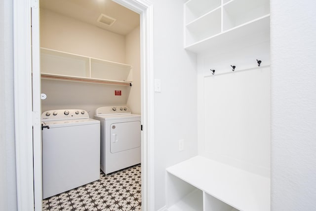 laundry room with independent washer and dryer