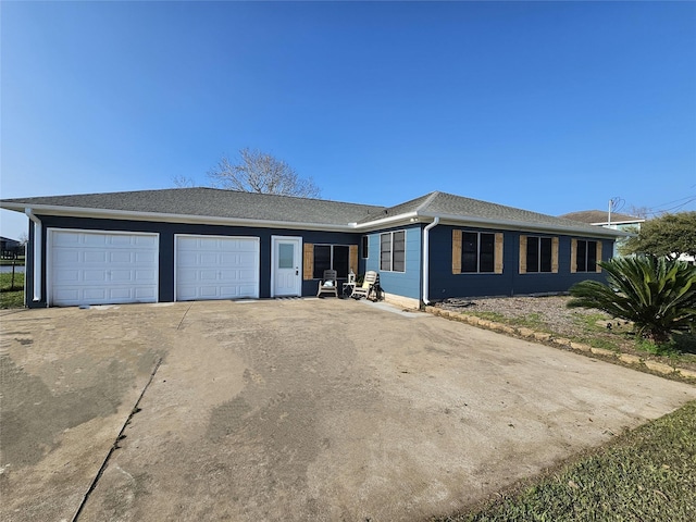 ranch-style home featuring a garage