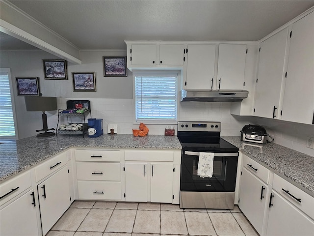 kitchen featuring crown molding, stainless steel electric range oven, white cabinets, light stone countertops, and backsplash