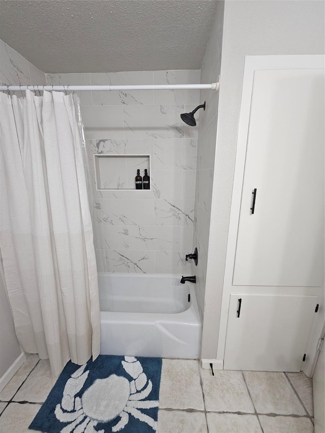 bathroom with shower / tub combo with curtain, tile patterned floors, and a textured ceiling