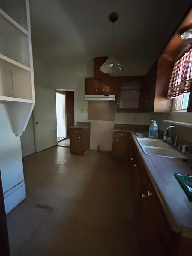 kitchen featuring sink and hanging light fixtures