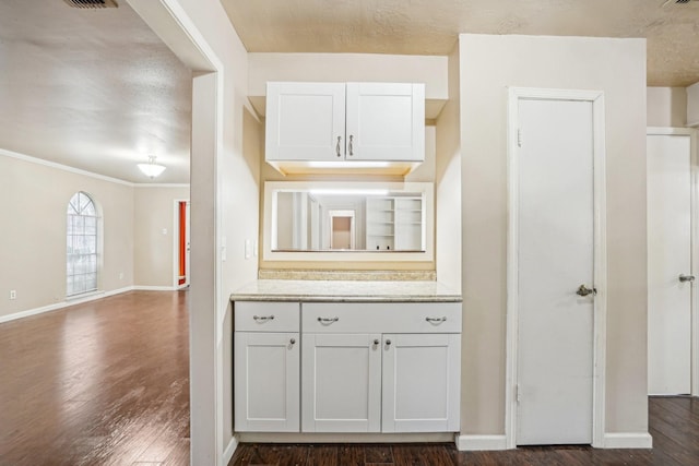 kitchen with white cabinetry and dark hardwood / wood-style flooring