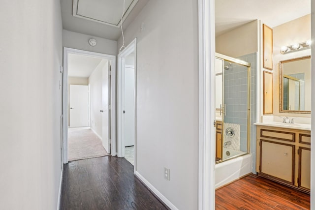 hallway featuring sink and dark hardwood / wood-style flooring