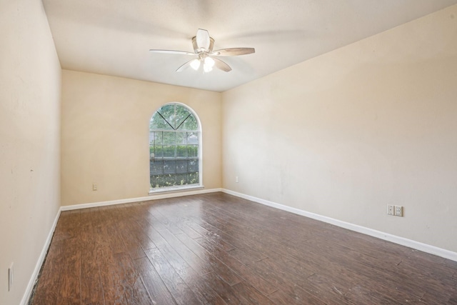 unfurnished room featuring ceiling fan and dark hardwood / wood-style floors