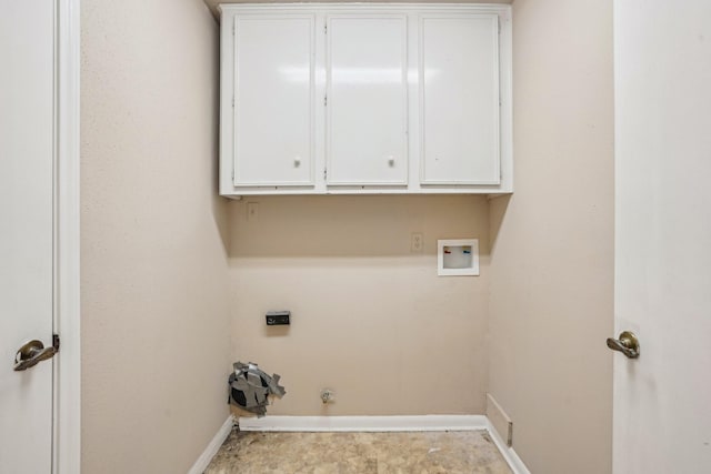 laundry area featuring hookup for a gas dryer, hookup for a washing machine, hookup for an electric dryer, and cabinets