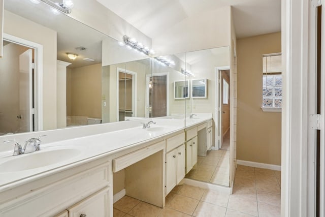 bathroom with tile patterned flooring and vanity