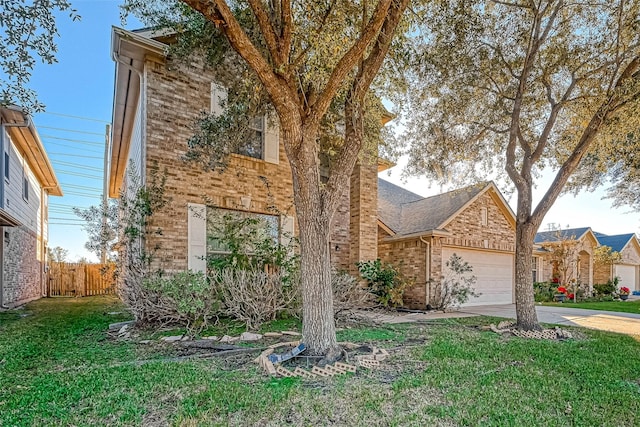 view of front of property featuring a garage and a front yard