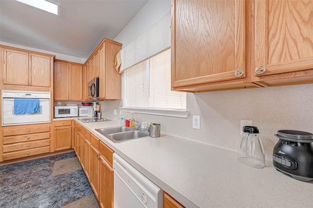 kitchen with white appliances and sink