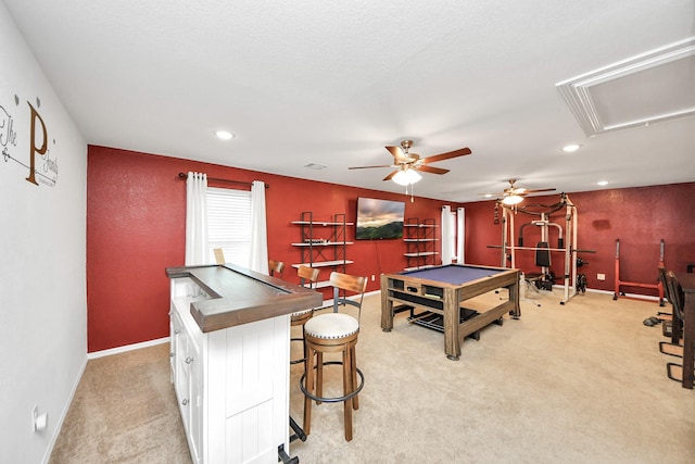 recreation room with light colored carpet