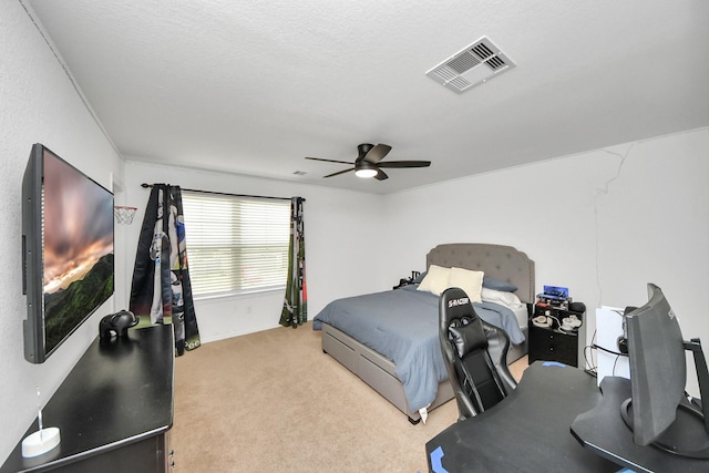 bedroom featuring light colored carpet and ceiling fan