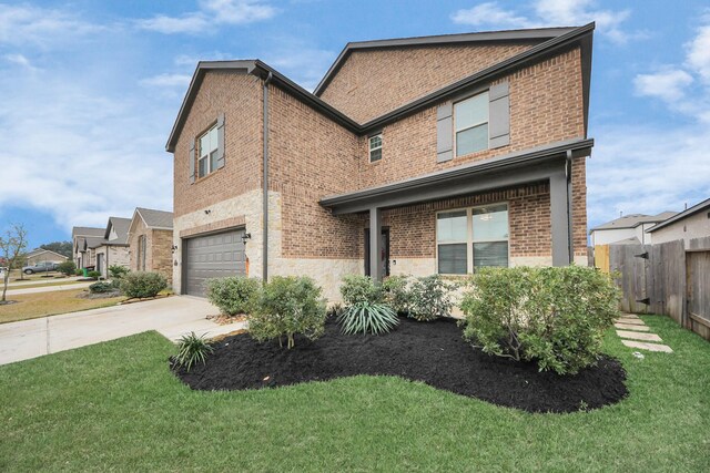 view of front of home featuring a garage and a front lawn