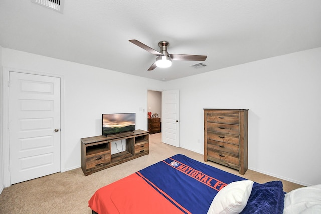 bedroom featuring ceiling fan and carpet