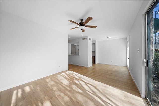 unfurnished living room featuring ceiling fan and light hardwood / wood-style flooring