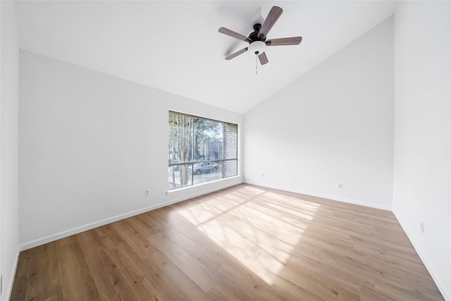 unfurnished room with ceiling fan, high vaulted ceiling, and light wood-type flooring