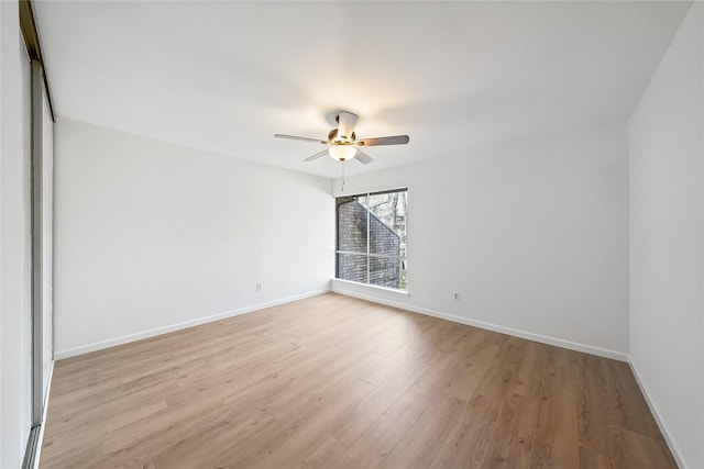 unfurnished room with ceiling fan and light hardwood / wood-style flooring