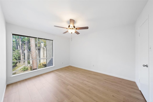 empty room featuring ceiling fan and light hardwood / wood-style floors