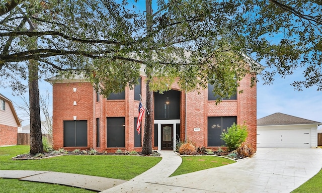 view of front of house featuring a garage and a front yard