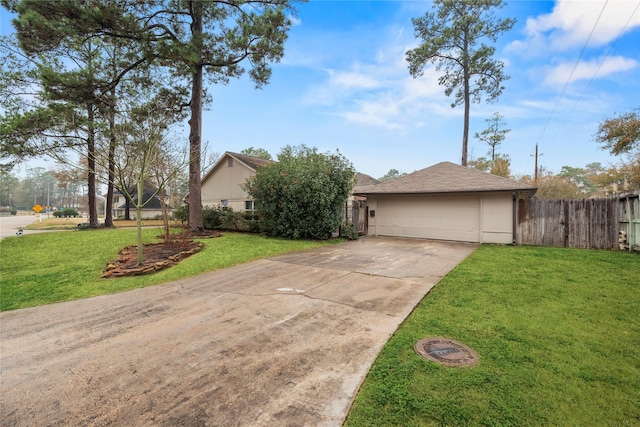 view of front of property featuring a garage and a front yard