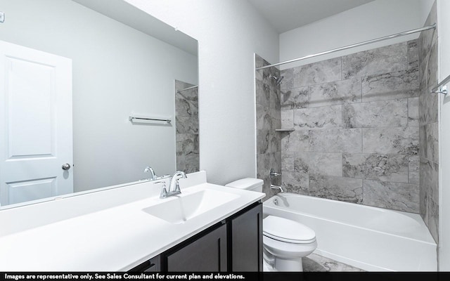 full bathroom featuring vanity, toilet, and tiled shower / bath