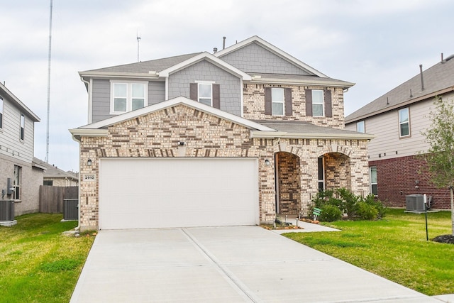 view of front of property with a garage, a front yard, and cooling unit