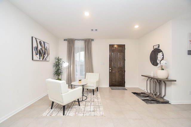 sitting room with recessed lighting, visible vents, and baseboards