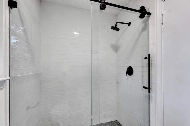 bathroom with tiled shower