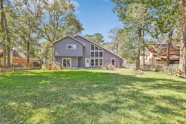 rear view of house with a lawn